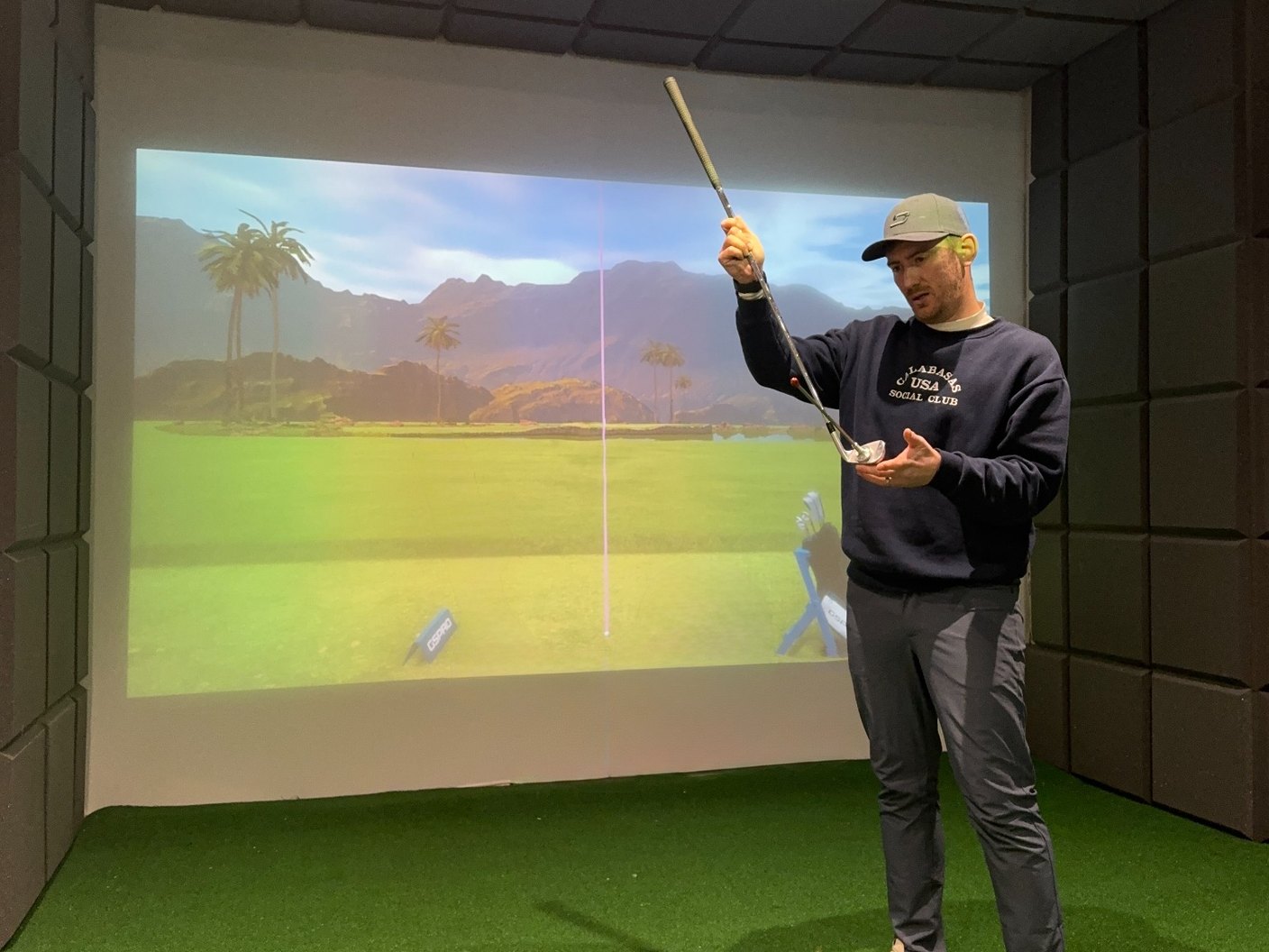 Oliver Gray coaching in the indoor studio at Woodside Golf Club